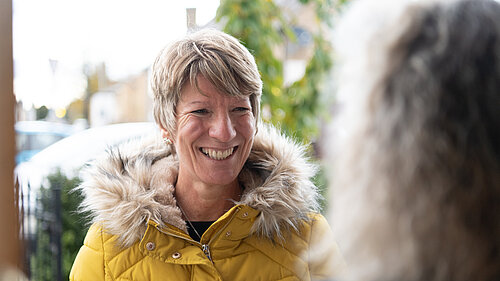 Pippa Heylings listening to a South Cambs resident on their doorstep