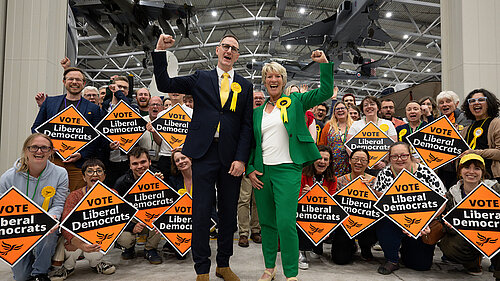 Ian Sollom and Pippa Heylings after the count at Duxford in front of lots of Lib Dems with diamonds